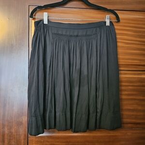 Silky small pleat knee length skirt